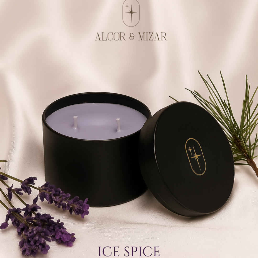 Purple candle in a black container with 'Alcor & Mizar' branding on a light background.