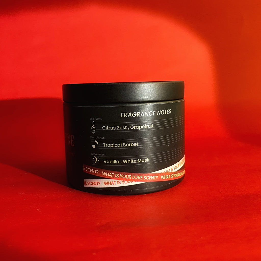 Black container with fragrance notes on a red background